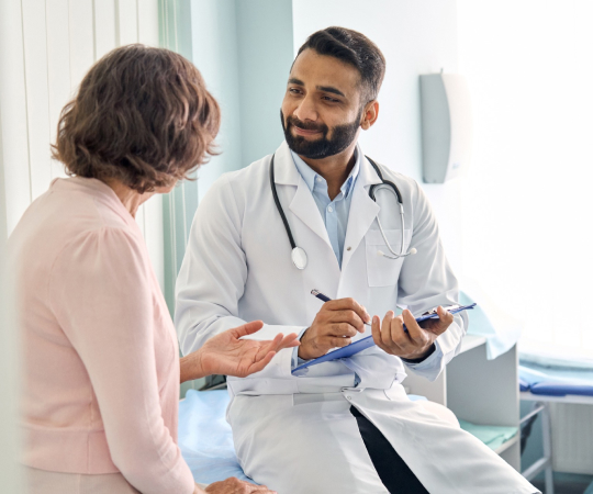 Physician Talking To Client